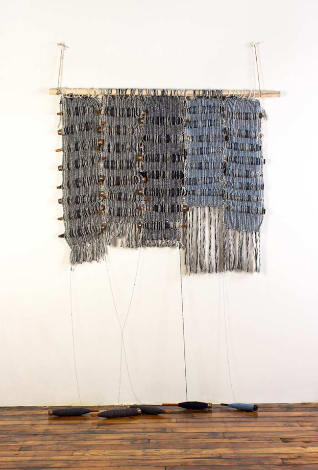 <em>Amy 2, Bobbins and handwoven fabric, 36x48”, 2013. </em>